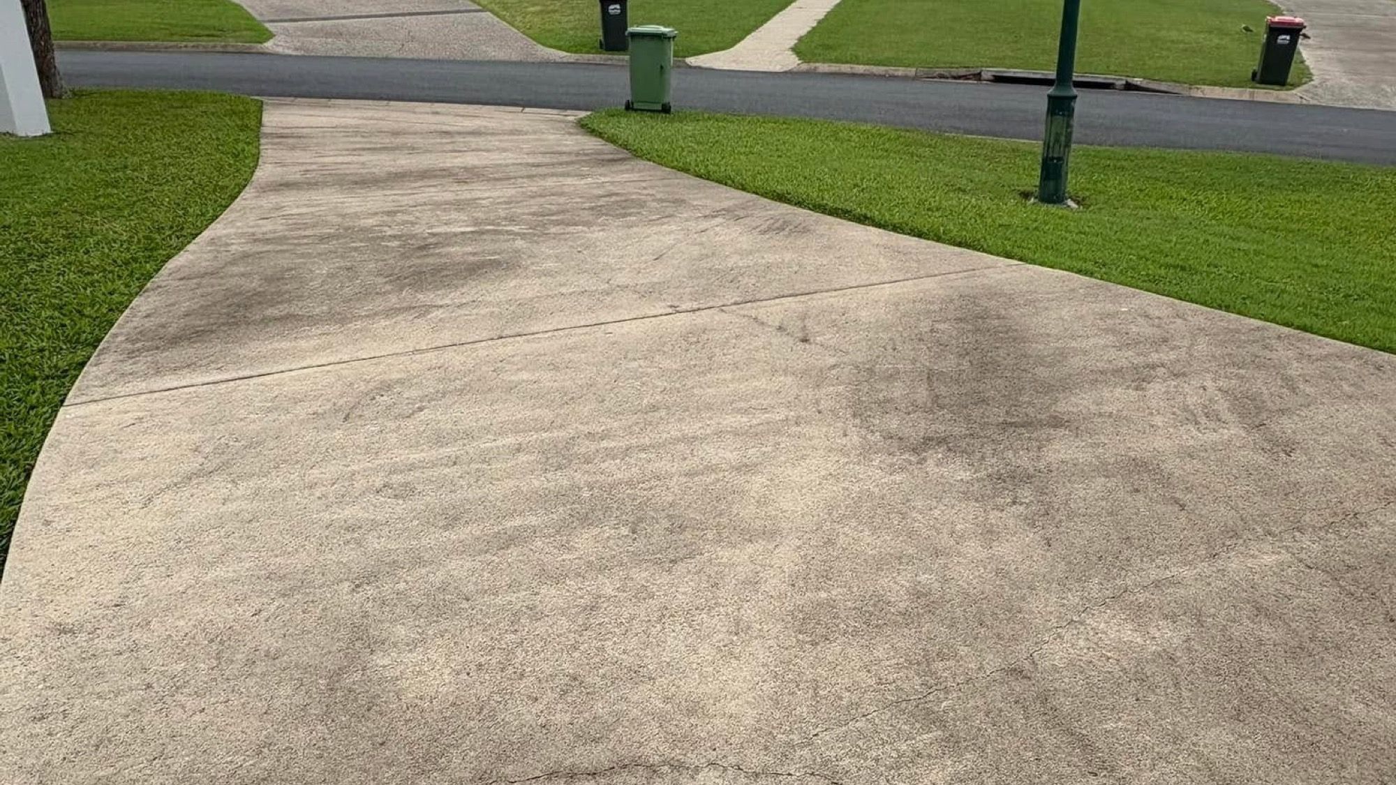 A concrete driveway running out to a Mackay street