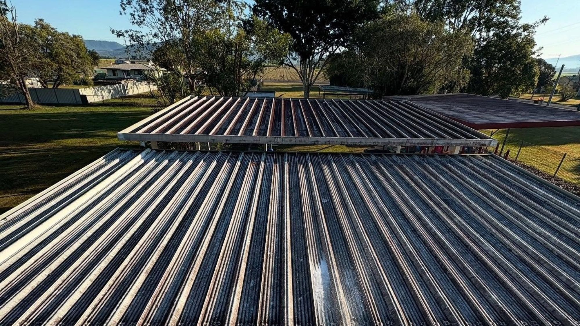 A corrugated metal roof seen along its length
