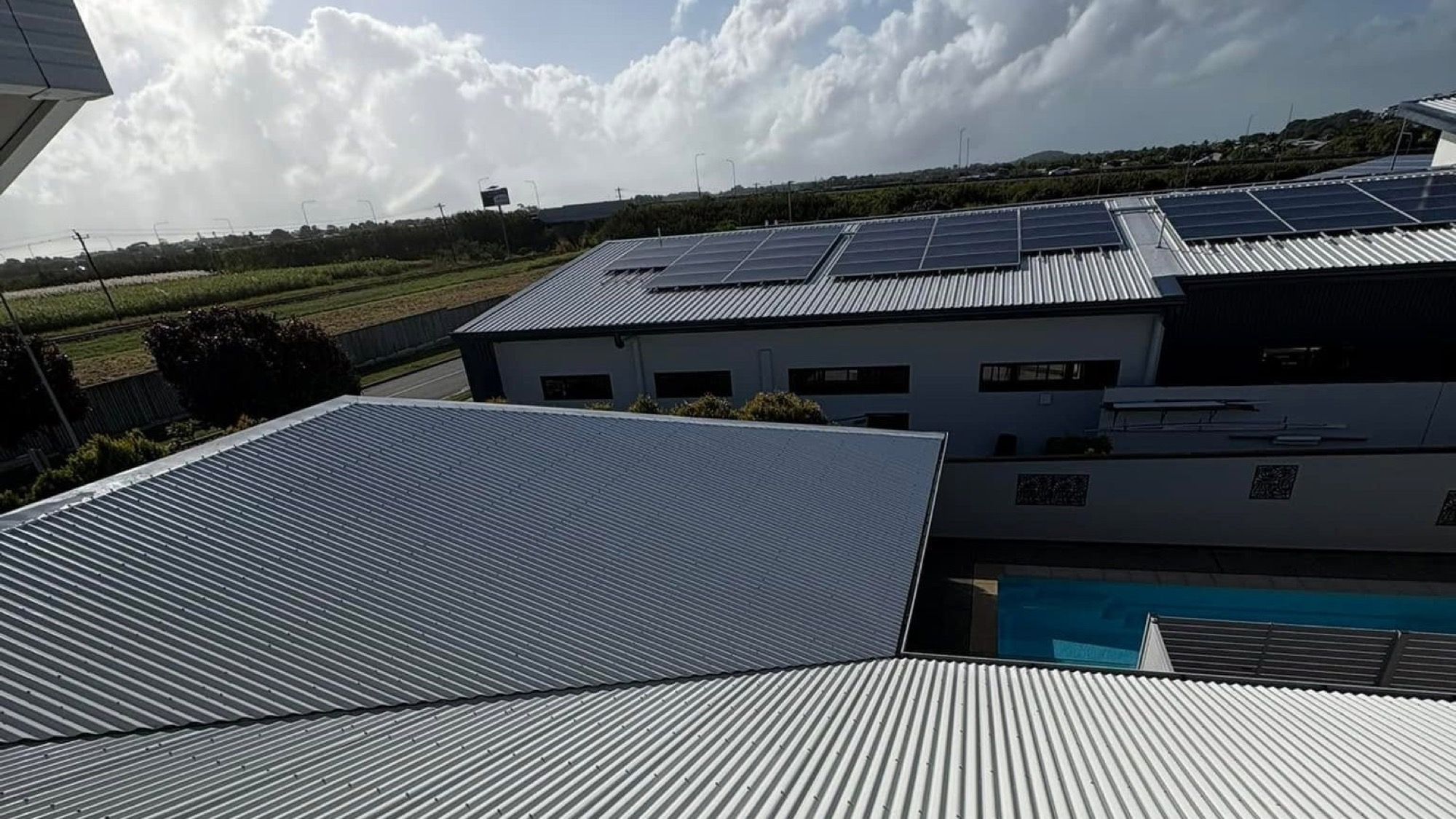 A corrugated metal roof above Mackay rooftops