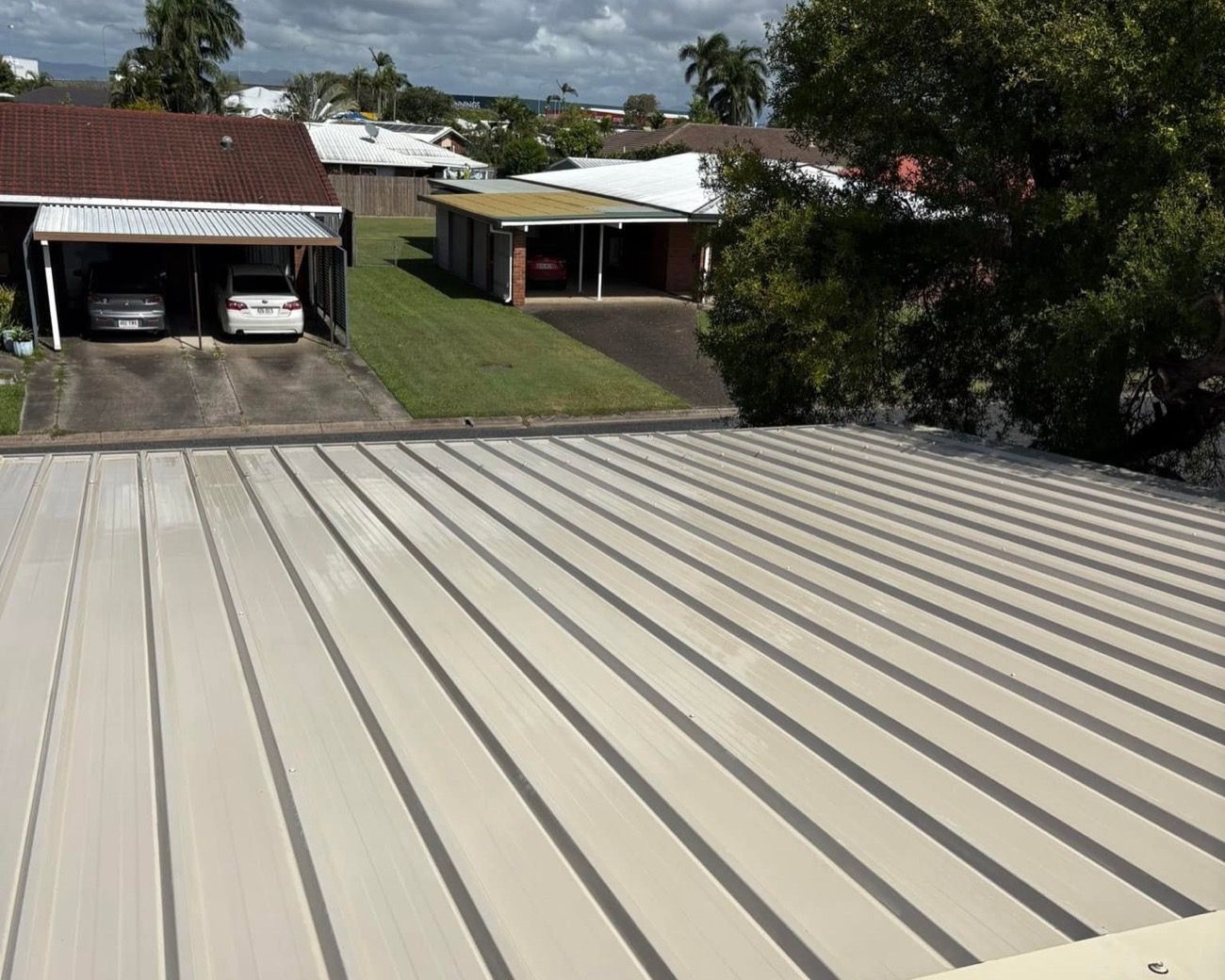A metal roof with a cleaning hose running across it