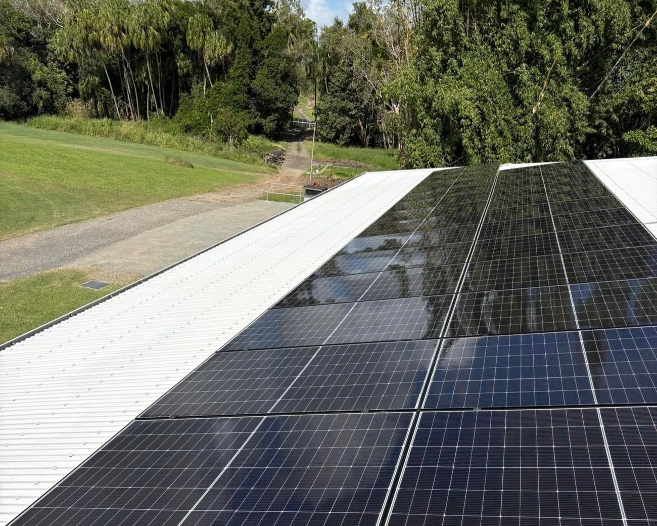 Solar panels laid across a metal roof