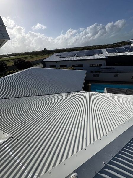 A corrugated metal roof above Mackay rooftops