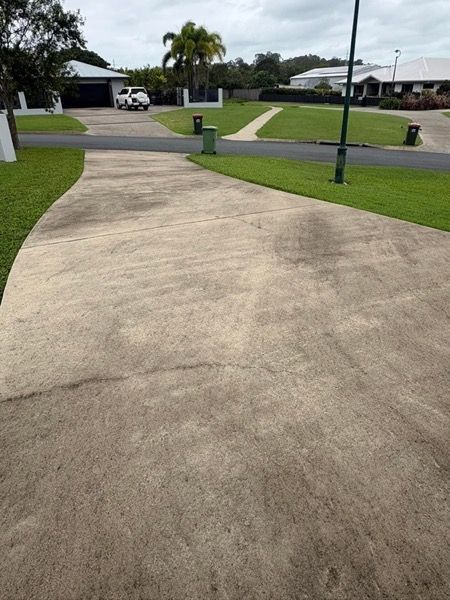 A concrete driveway running out to the street