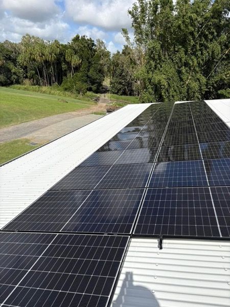 Solar panels laid across a metal roof