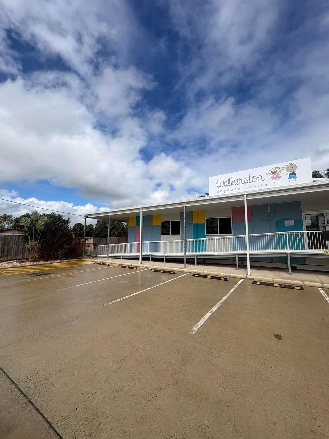 A commercial building and its wet carpark
